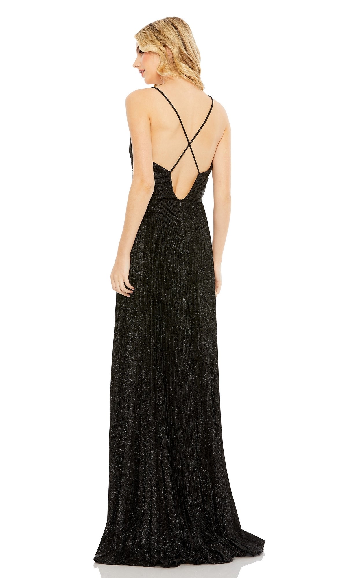 A woman in the Pleated Empire-Waist Long A-Line Prom Dress 30725, a sleeveless black gown with crisscross straps and a low back, stands facing away from the camera.